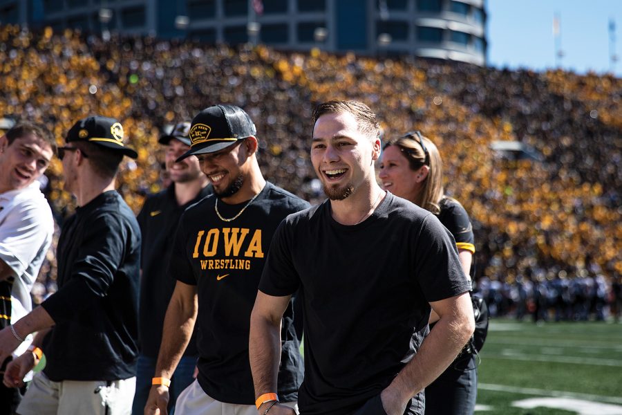 Iowas+125-pound+Spencer+Lee+walks+off+the+field+after+being+honored+during+a+football+game+between+Iowa+and+Michigan+on+Saturday+Oct.+1%2C+2022.+The+Iowa+wrestling+team+has+its+first+match+on+Sunday%2C+Nov.+13.