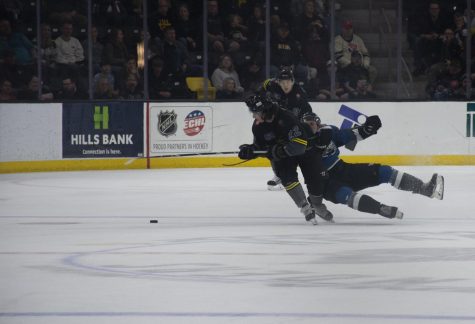 Iowa forward Zach White races for the puck during a hockey game at Xtream Arena in Coralville on Friday, Oct. 21, 2022. The Idaho Steelheads defeated The Iowa Heartlanders, 6-2.