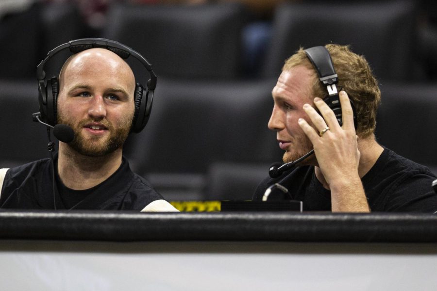 Former Iowa wrestlers Alex Marinelli, left, and Kaleb Young, right commentate for BTN plus during a wrestling meet between Iowa and Cal Baptist at Carver-Hawkeye Arena on Sunday, Nov. 13, 2022. The Hawkeyes defeated the Lancers, 42-3. 