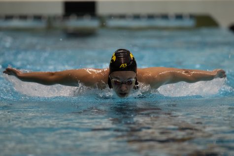 Iowas Sabina Kupcova comes in fast with her finishing up the butterfly portion of the the 50 Yard during day one of the 2022 Hawkeye Invitational  at the Campus recreational and Wellness Center in Iowa City on Thursday, Dec. 1, 2022. Kupcova came in 19th place with a time of 24:00.