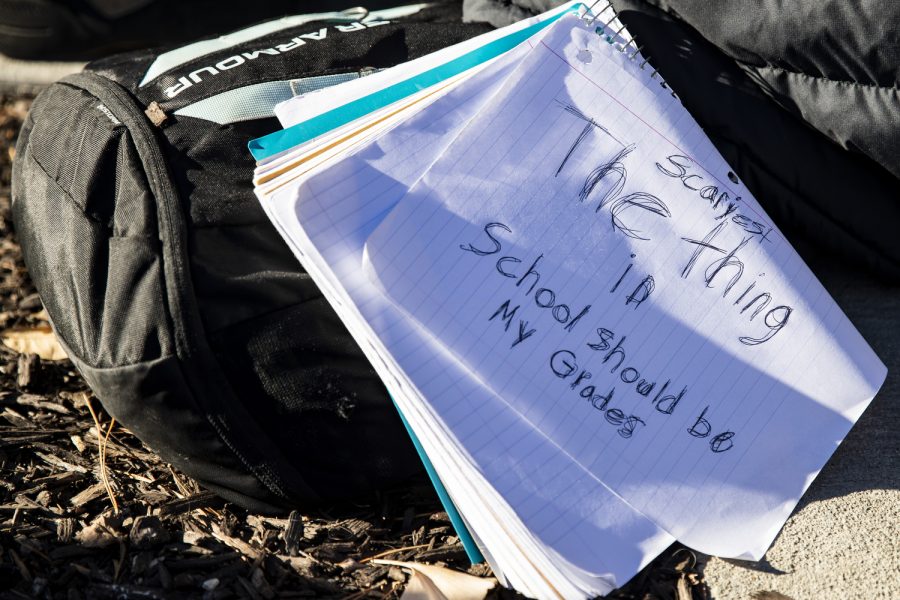 A notebook leans against a student’s backpack during a protest against gun violence put on by Iowa City high school students on the Pentacrest at the University of Iowa on Thursday, Dec. 1, 2022. The protest hosted student speakers, and an opportunity for attendees to speak as well.