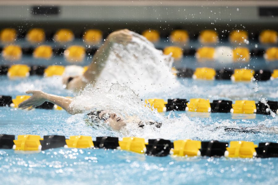 Iowa’s Ken Gilbertson swims during heat 2 of the 200 meter backstroke during day three of the 2022 Hawkeye Invitational at the Campus Recreation and Wellness Center in Iowa City on Saturday, Dec. 3, 2022. 