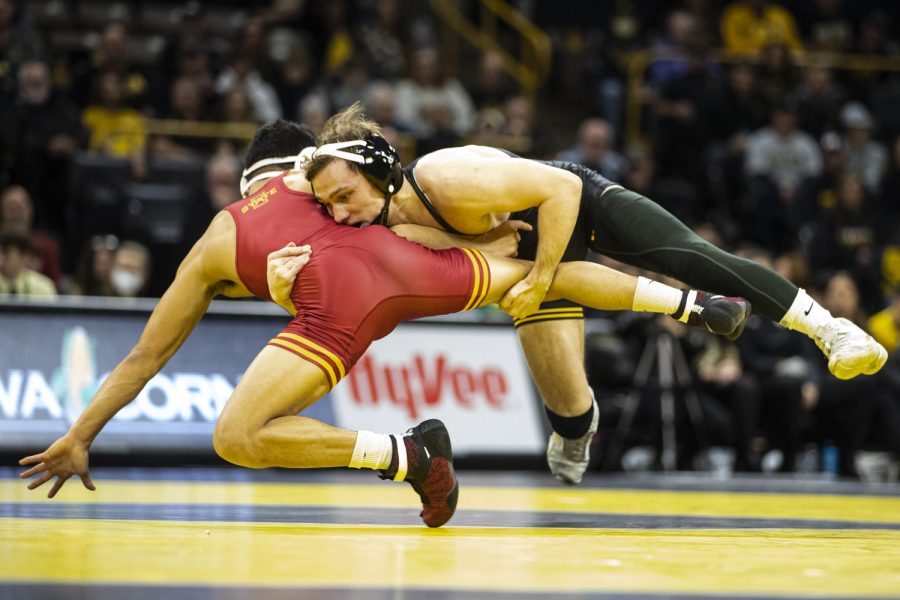 Iowa%E2%80%99s+125-pound+Spencer+Lee+takes+down+Iowa+States+125-pound+Corey+Cabanban+during+a+wrestling+meet+between+No.+2+Iowa+and+No.+7+Iowa+State+at+Carver-Hawkeye+Arena+in+Iowa+City+on+Sunday%2C+Dec.+4%2C+2022.+Lee+defeated+Cabanan+by+a+major+decision%2C+16-5.+The+Hawkeyes+defeated+the+Cyclones%2C+18-15.+