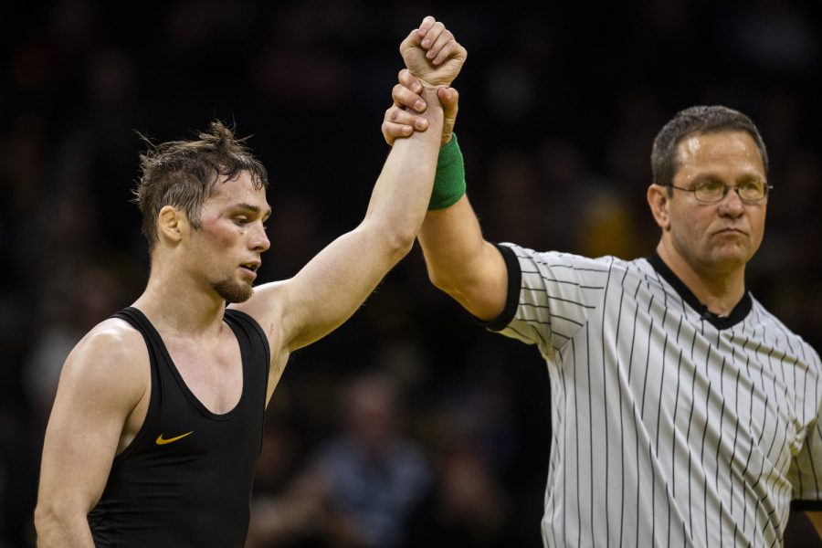 Iowa’s 125-pound Spencer Lee celebrates a victory over Iowa States 125-pound Corey Cabanban during a wrestling meet between No. 2 Iowa and Iowa State at Carver-Hawkeye Arena in Iowa City on Sunday, Dec. 4, 2022. The Hawkeyes defeated the Cyclones, 18-15. 