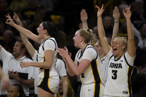 Iowa teammates cheer during a women’s basketball game between Iowa and Iowa State at Carver-Hawkeye Arena  in Iowa City on Wednesday, Dec. 7, 2022. The Hawkeyes defeated the Cyclones, 70-57.