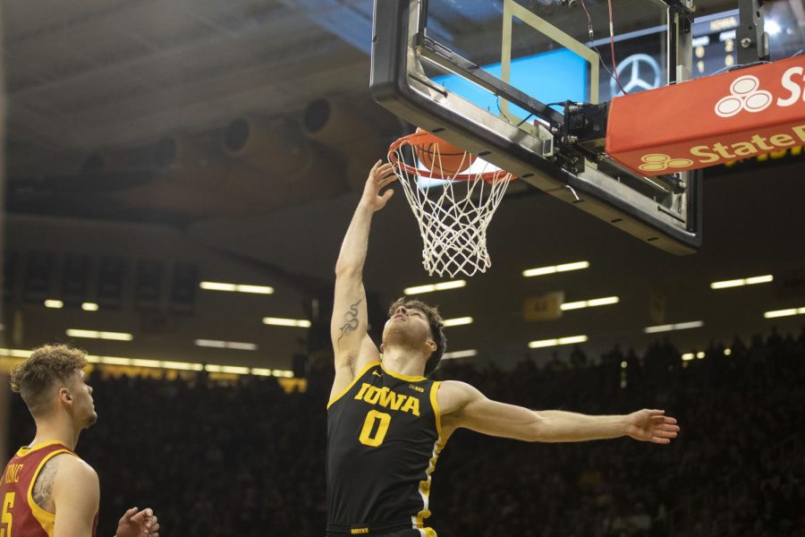 Iowa forward Filip Rebraca shoots a layup during a mens basketball game between Iowa and Iowa State at Carver-Hawkeye Arena in Iowa City on Dec. 8, 2022. The Hawkeyes defeated the Cyclones, 75-56. Rebraca scored 22 points and collected 11 rebounds.