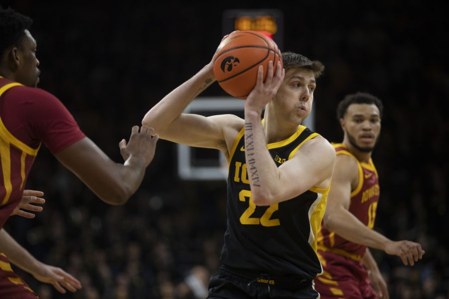 Iowa forward Patrick McCaffery  looks to pass during a basketball game Iowa and Iowa State at Carver-Hawkeye Arena in Iowa City on Dec. 8, 2022. The Hawkeyes defeated the Cyclones, 75-56. McCafferey scored 13 points.