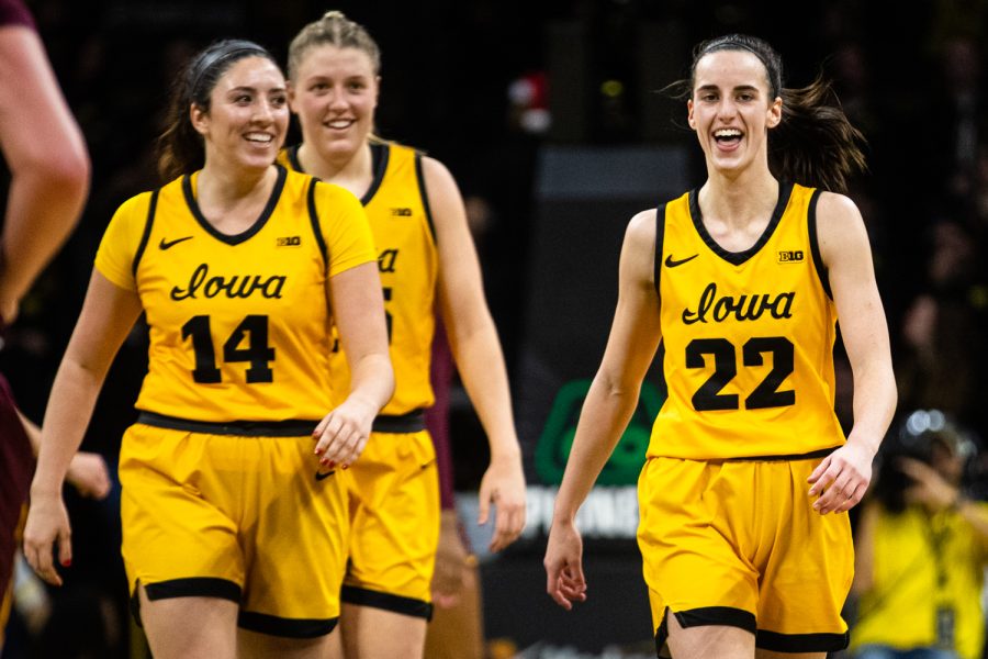 Iowa forward McKenna Warnock, Iowa guard Caitlin Clark, and Iowa center Monika Czinano smile during a womens basketball game between Iowa and Minnesota at Carver-Hawkeye Arena in Iowa City on Saturday, Dec. 10, 2022. The pair combined for 44 points. The Hawkeyes defeated the Gophers, 87-64.