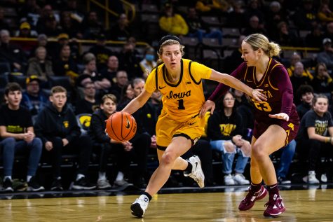 Iowa guard Molly Davis dribbles the ball during a womens basketball game between Iowa and Minnesota at Carver-Hawkeye Arena in Iowa City on Saturday, Dec. 10, 2022. Davis earned three assists. The Hawkeyes defeated the Gophers, 87-64.