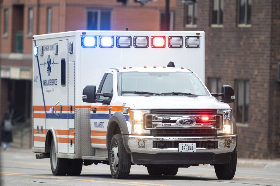 A Johnson County ambulance transports a suspect after the Iowa City Police Department was called to the Court Street parking ramp for what started as a welfare check in downtown Iowa City on Monday, Dec. 12, 2022. According to a UI Police affidavit, officers received a third-party report that a woman had been forced against her will to go to the bus station by her husband, who allegedly took her from a Cedar Rapids location on Sunday night. After police arrived, Cardale Hunter, 33, pulled out a gun and used the woman as a shield while holding her at gunpoint. According to the City of Iowa City press release, the situation was resolved after the man shot himself, but no other injuries have been reported. Hunter is in stable condition. Hunter is facing charges of second-degree kidnapping, possession of a firearm by a felon, going armed with intent, domestic abuse while displaying a weapon, and child endangerment, according to a UI police release.