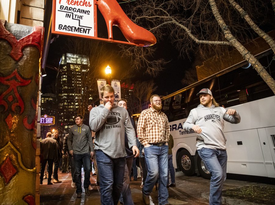 Iowa players walk toward their bus after a welcome party for the 2022 Transperfect Music City Bowl at Wild Horse Saloon in Nashville on Wednesday, Dec. 28, 2022. The Hawkeyes and Wildcats participated in a wing-eating challenge and a sing-off.