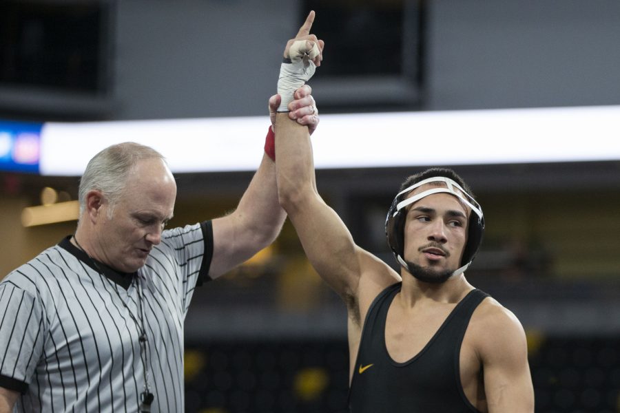 Iowa wrestler Real Woods (141) hand is raised after defeating Northern Iowa wrestler Connor Thorpe during session two of the Soldier Salute Wrestling tournament at Xtream arena at Iowa River Landing on Thursday, Dec. 29, 2022.