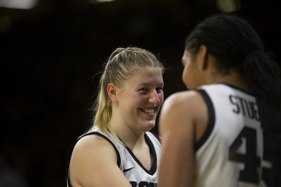 Iowa forward Hannah Stuelke congratulates Iowa center Monika Czinano after surpassing 2000 total career points during a women’s basketball game between Iowa and Purdue at Carver-Hawkeye Arena in Iowa City on Thursday, Dec 29, 2022. The Hawkeyes defeated the Boilermakers, 83-68. Czinano is the second Iowa player this season to break 2000 points behind guard Caitlin Clark.