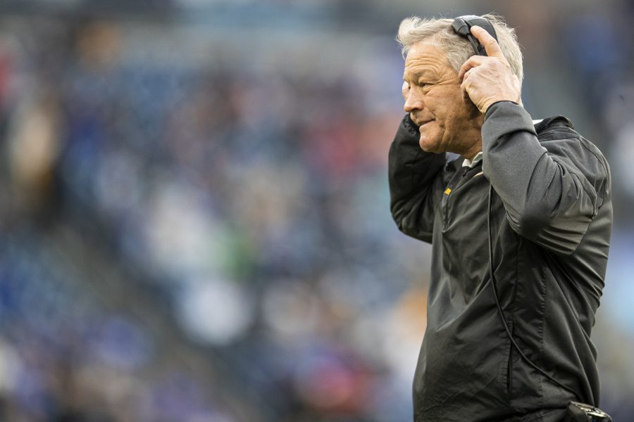 Iowa head coach Kirk Ferentz puts on a headset during the 2022 TransPerfect Music City Bowl between Iowa and Kentucky at Nissan Stadium in Nashville. The Iowa offense recorded 206 yards compared to Kentucky’s 185. The Hawkeyes defeated the Wildcats, 21-0.