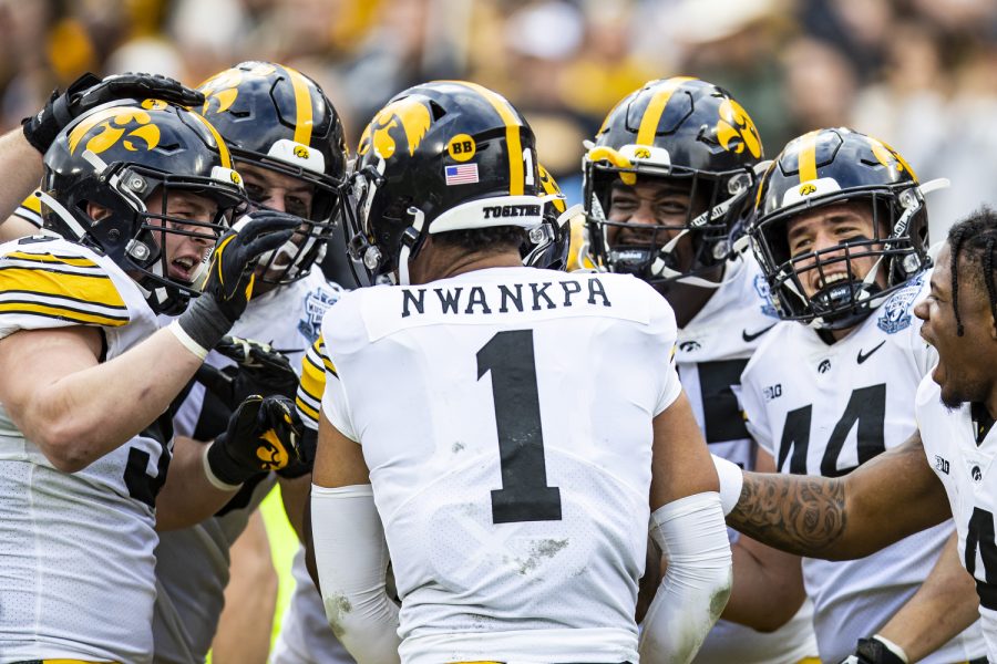 Iowa celebrates defensive back Xavier Nwankpa’s touchdown after an interception during the 2022 TransPerfect Music City Bowl at Nissan Stadium in Nashville on Saturday, Dec. 31, 2022. Nwankpa’s interception return went for 52 yards and a touchdown. The Hawkeyes became the 2022 TransPerfect  Music City Bowl champions after defeating the Wildcats, 21-0.