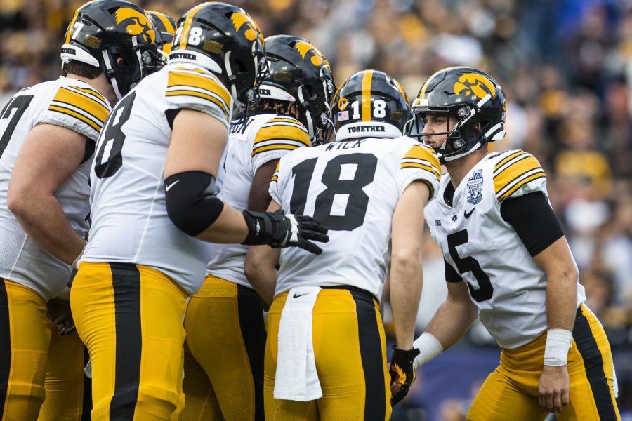 Iowa+quarterback+Joe+Labas+calls+a+play+in+the+huddle+during+the+2022+TransPerfect+Music+City+Bowl+between+Iowa+and+Kentucky+at+Nissan+Stadium+in+Nashville.+Labas+passed+for+139+yards+and+a+touchdown.+The+Hawkeyes+defeated+the+Wildcats%2C+21-0.