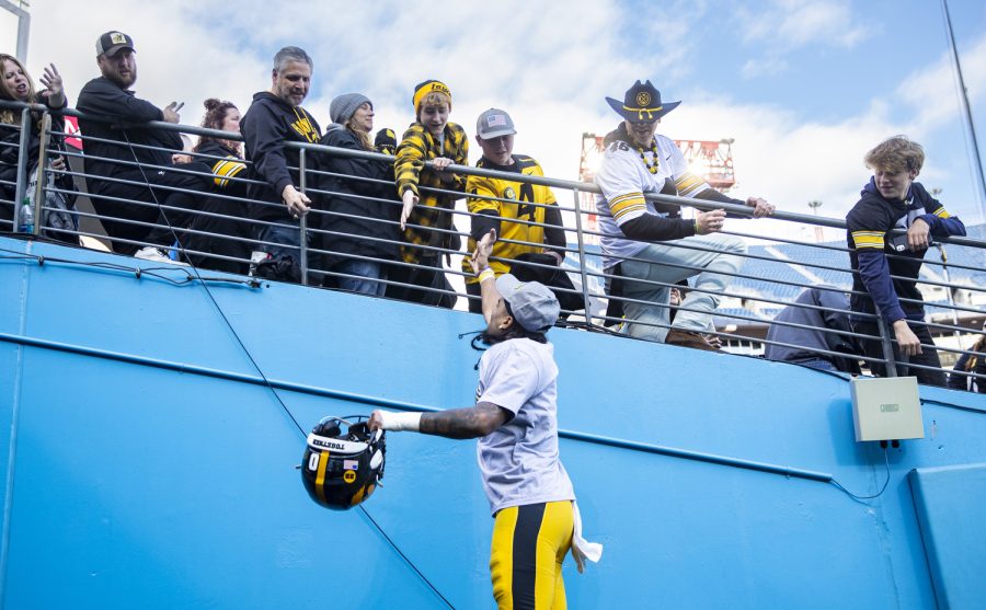 Iowa wide receiver Diante Vines celebrates with fans after the 2022 TransPerfect Music City Bowl at Nissan Stadium in Nashville on Saturday, Dec. 31, 2022. The Hawkeyes became the 2022 TransPerfect  Music City Bowl champions after defeating the Wildcats, 21-0.