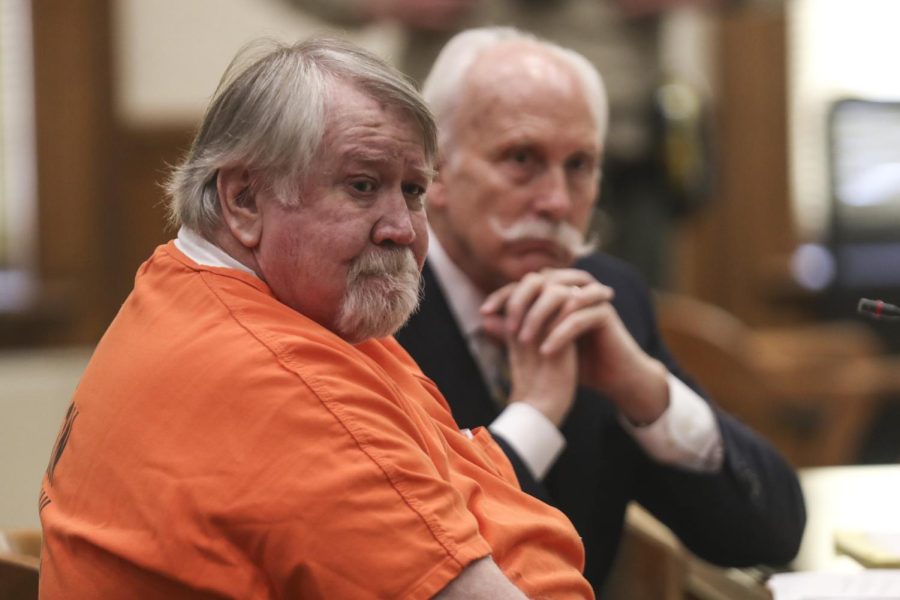 Roy Carl Browning Jr, 70, and his attorney Leon Spies listen to his daughter Elizabeth Adrianse read her victim impact statement during a sentencing hearing on Friday, Dec. 2, 2022, at Johnson County Courthouse in Iowa City, Iowa. 