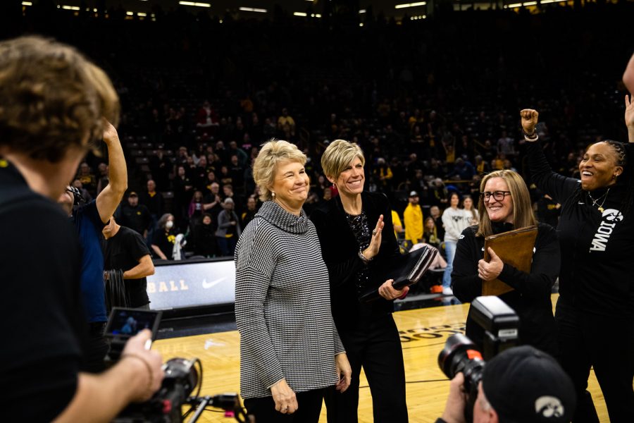 Iowa head coach Lisa Bluder celebrates becoming the Big Tens all-time leader in regular season conference wins with 234 during a womens basketball game between Iowa and Minnesota at Carver-Hawkeye Arena in Iowa City on Saturday, Dec. 10, 2022. The Hawkeyes defeated the Gophers, 87-64.