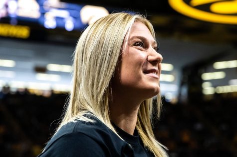 Felicity Taylor looks up into the crowd during a NCAA wrestling dual between Iowa and California Baptist, Sunday, Nov. 13, 2022, at Carver-Hawkeye Arena in Iowa City, Iowa.