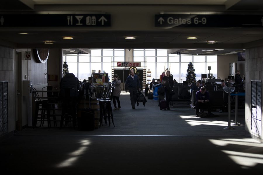Travelers wait by the gates at the Eastern Iowa Airport (CID) Wednesday, Nov. 30, 2022.