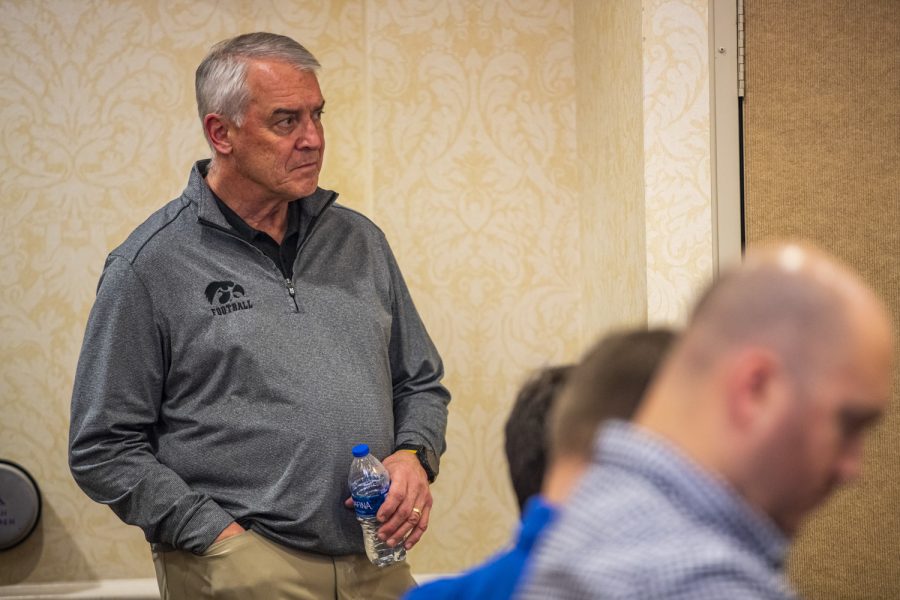 Iowa athletic director Gary Barta listens to Iowa head coach Kirk Ferentz speak during a joint coaches press conference for the 2022 TransPerfect Music City Bowl at Gaylord Resort and Convention Center in Nashville on Friday, Dec. 30, 2022.