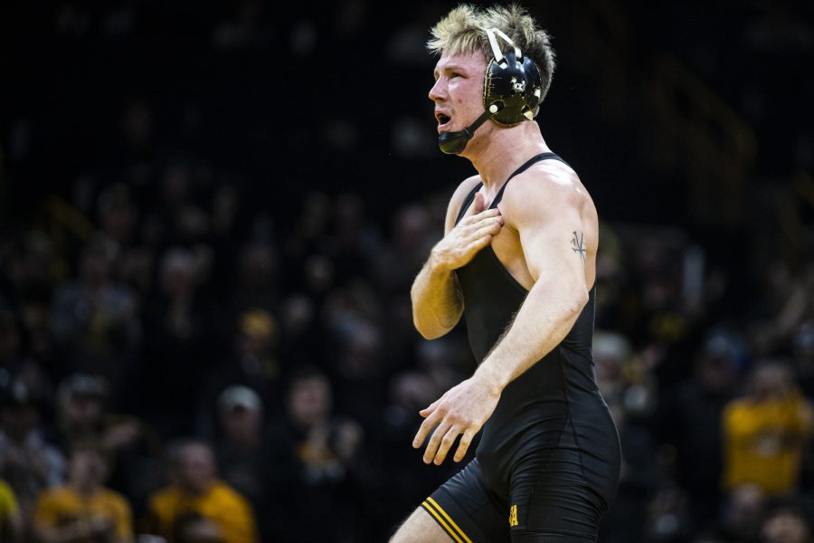 Iowa’s No. 9 149-pound Max Murin celebrates a win over Illinois 149-pound Kevon Davenport during a wrestling meet between No. 2 Iowa and Illinois at Carver-Hawkeye Arena in Iowa City on Friday, Jan. 6, 2023. Murin defeated Davenport by fall in three minutes and 34 seconds. The Hawkeyes defeated the Illini, 25-19.