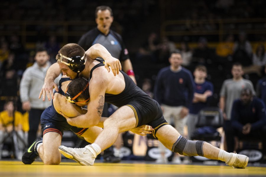 Iowa%E2%80%99s+No.+12+165-pound+Patrick+Kennedy+shoots+for+a+takedown+on+Illinois+No.+16+165-pound+Danny+Braunagel+during+a+wrestling+meet+between+No.+2+Iowa+and+Illinois+at+Carver-Hawkeye+Arena+in+Iowa+City+on+Friday%2C+Jan.+6%2C+2023.++Kennedy+defeated+Braunagel+by+major+decision%2C+16-13.+The+Hawkeyes+defeated+the+Illini%2C+25-19.