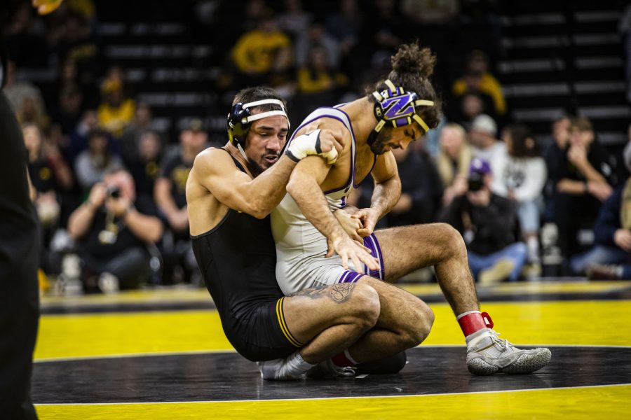 Iowa’s No.2 141-pound wrestler Real Woods wrestles Northwestern’s No.6 Frankie Tal-Scharar during a dual between Iowa and Northwestern at Carver-Hawkeye Arena in Iowa City on Jan. 14, 2023. The Hawkeyes defeated the Wildcats, 27-9.