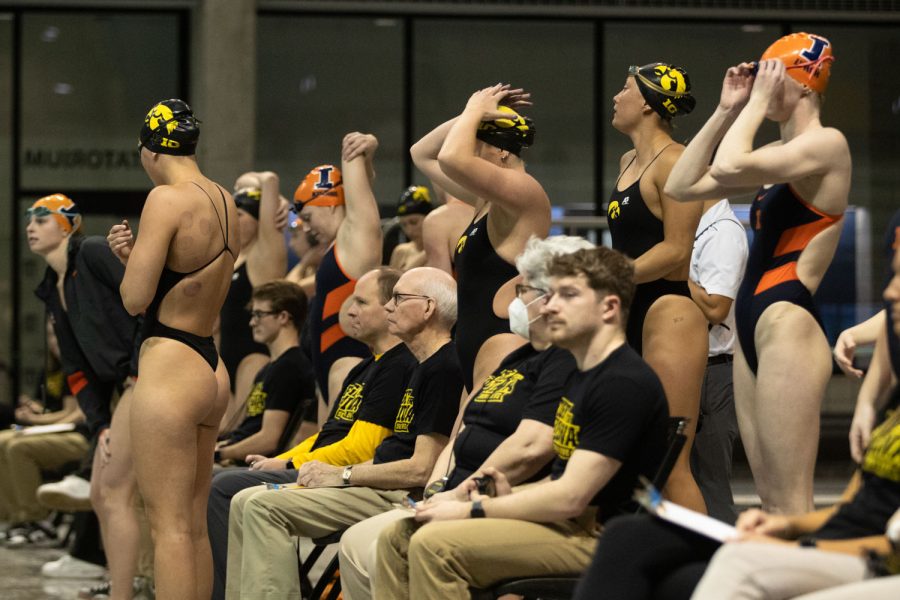 Swimmers prepare for the 200 yard freestyle relay during a swim and dive meet between Iowa and Illinois in Iowa City on Friday, Jan 13, 2023. The Fighting Illini won the duel meet against the Hawkeyes, 46-45.
