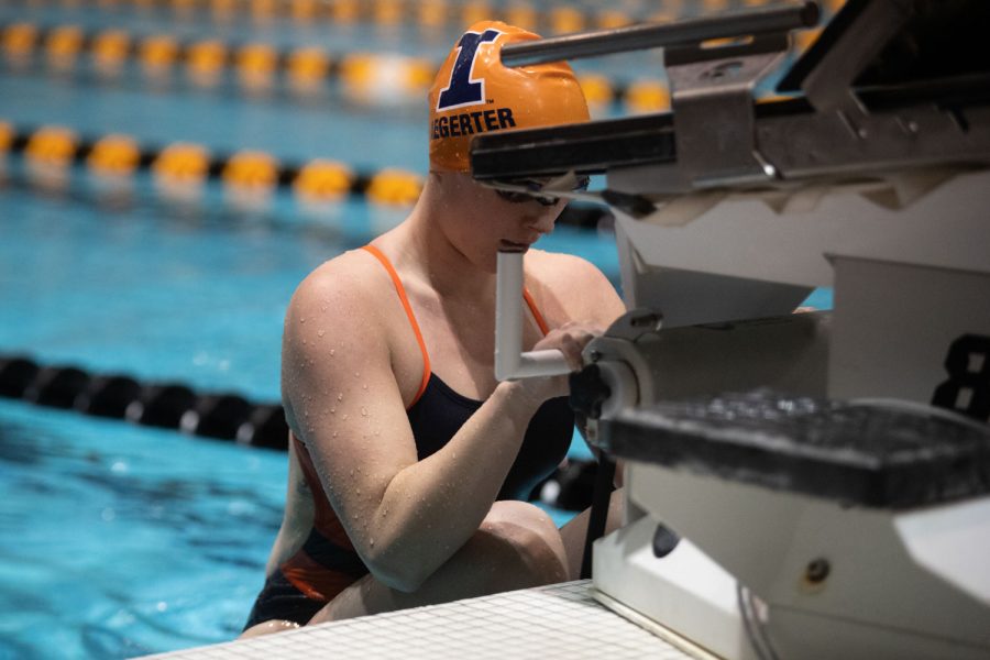 Illinois swimmer Hannah Aegerter holds her position as she waits for the start of the 400 yard medley relay during a swim and dive meet between Iowa and Illinois in Iowa City on Friday, Jan 13, 2023. The Fighting Illini won the duel meet against the Hawkeyes, 46-45.