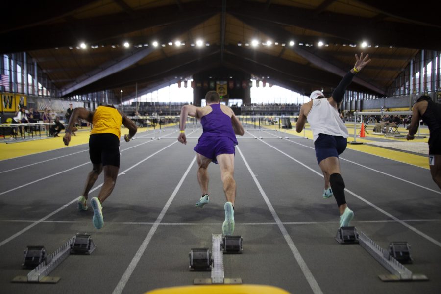 Runners get set before heat 2 of the men’s 60-meter hurdle prelim at the Jimmy Grant Invitational track meet at the the Hawkeye Indoor Track Facility in Iowa City on Saturday Jan. 14, 2023.