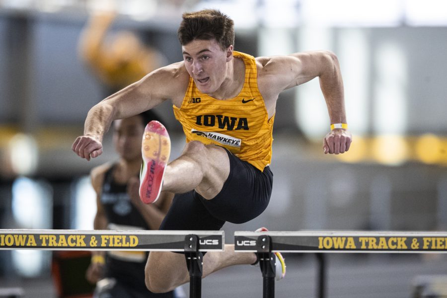 Iowa’s Austin West runs in the men’s 60-meter hurdles prelim during the Hawkeye Invitational at the University of Iowa Recreation Building in Iowa City on Saturday, Jan. 14, 2023. West qualified for the finals after running 8.04 seconds. The Hawkeye Invitational hosted Ball State, Bradley, Indian Hills, Iowa, Iowa Central, Missouri, Northern Iowa, Western Illinois, Wis.-River Falls, and unattached individuals.
