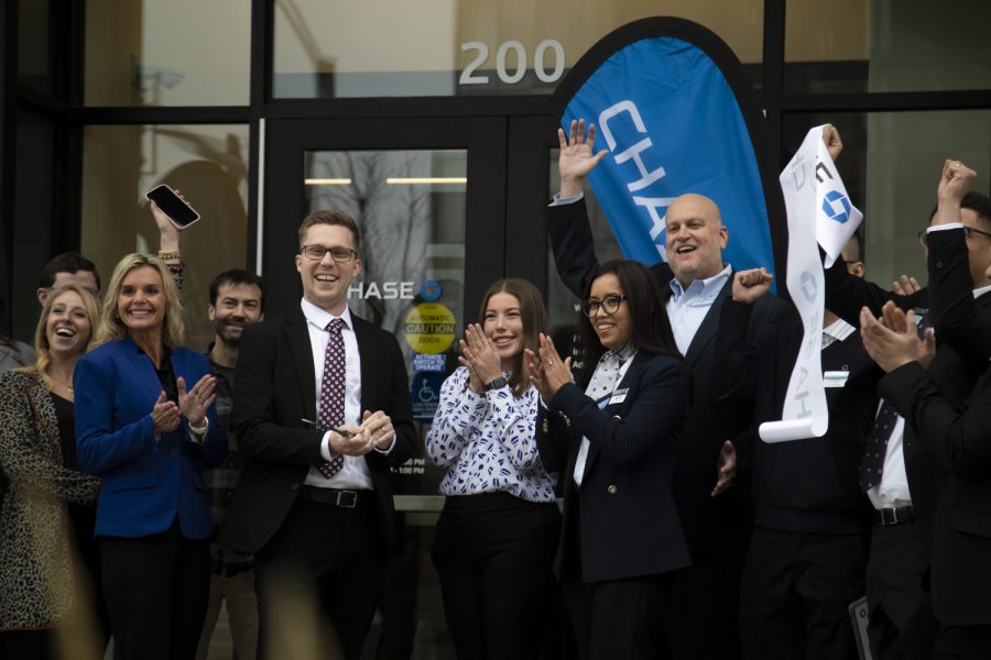 Chase Bank employees celebrate during a ribbon cutting ceremony at Chase Bank in downtown Iowa City Wednesday, Jan. 17, 2023. (Matt Sindt/The Daily Iowan)