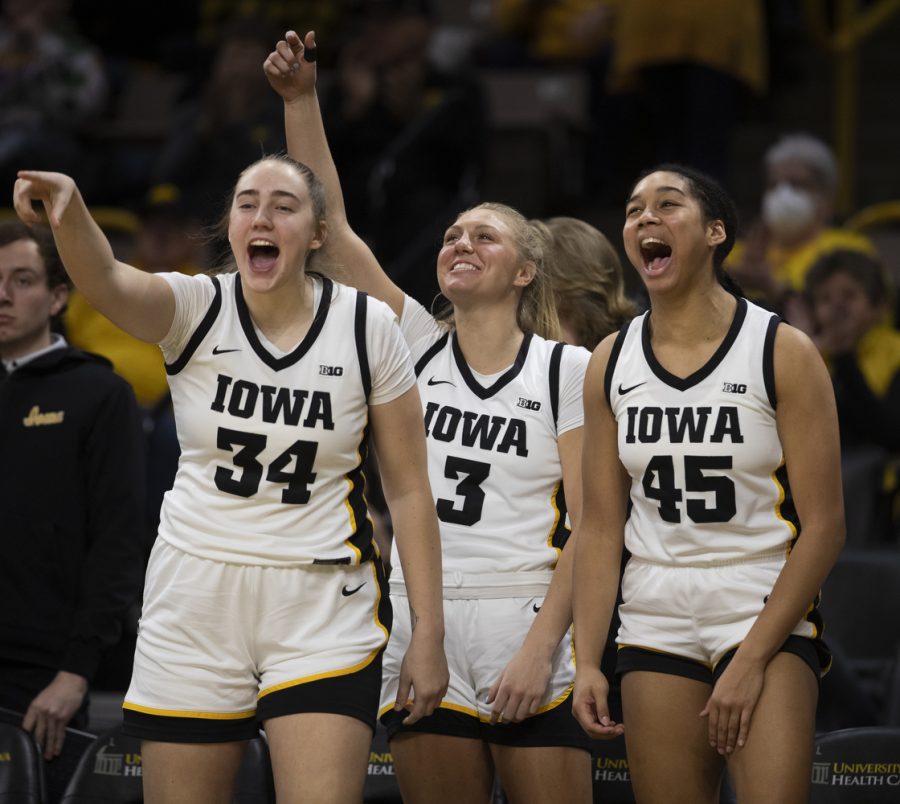Iowa teammates celebrate during a women’s basketball game between No. 10 Iowa and Nebraska at Carver-Hawkeye Arena in Iowa City on Saturday, Jan. 23, 2022. The Hawkeyes defeated the Huskers, 80-76.