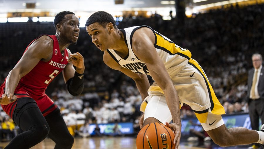Iowa forward Kris Murray drives to the hoop while being defended by Rutgers forward Aundre Hyatt during a men’s basketball game between Iowa and Rutgers at Carver-Hawkeye Arena in Iowa City on Sunday, Jan. 29, 2023. Murray recorded one assist. The Hawkeyes defeated the Scarlet Knights, 93-82.