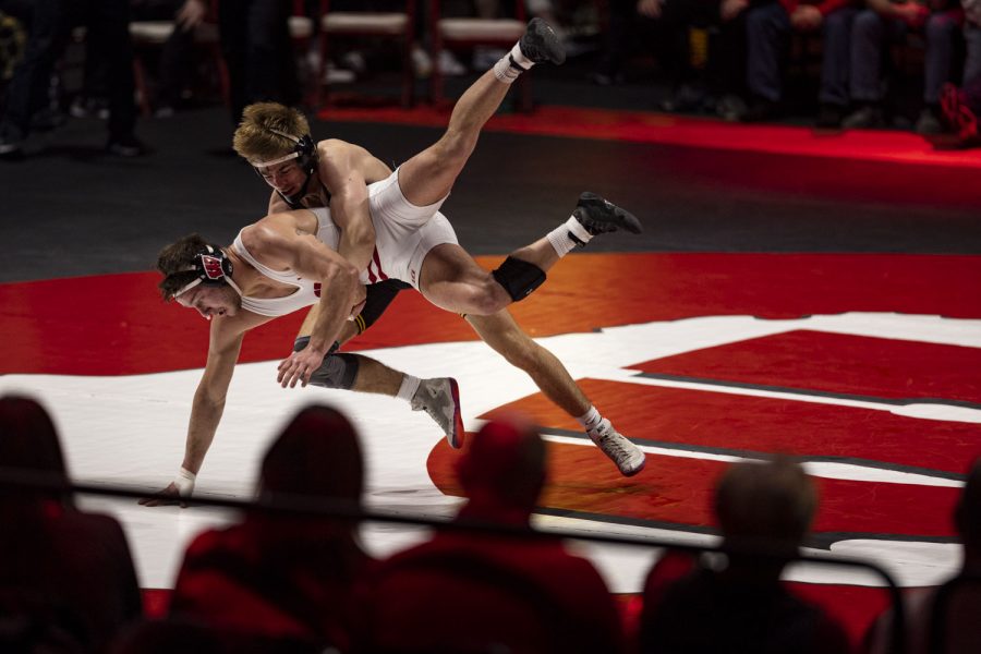 Iowa’s 174-pound Drake Rhodes wrestles Wisconsin’s Josh Otto during a wrestling dual between No. 2 Iowa and No. 16 Wisconsin at the Wisconsin Field House in Madison, Wis. on Sunday, Jan. 22, 2023. Otto defeated Rhodes by decision, 6-5. The Hawkeyes defeated the Badgers 19-18. After the dual, one point was awarded to Iowa for criteria for most match points to break the tie.