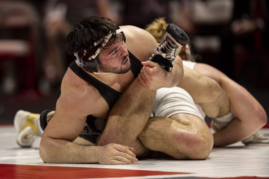 No. 3 nationally ranked 285-pound Iowa’s Tony Cassioppi wrestles No. 11 nationally ranked 285-pound Wisconsin’s Trent Hillger during a wrestling dual between No. 2 Iowa and No. 16 Wisconsin at the Wisconsin Field House in Madison, Wis. on Sunday, Jan. 22, 2023. Cassioppi defeated Hillger by decision, 4-1. The Hawkeyes defeated the Badgers 19-18. After the dual, one point was awarded to Iowa for criteria for most match points to break the tie.