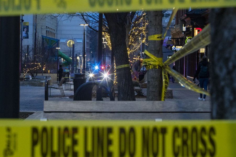 A police car sits near the entrance of Brother’s Bar and Grill after reports of shots fired near the Pedestrian Mall in Iowa City, Iowa on Saturday, Jan. 14, 2023. Officers were able to detain the shooter, no one is believed to have been injured. 