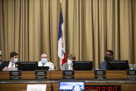 City council members communicate during an Iowa City City Council meeting at City Hall on  Jan. 24, 2023. 