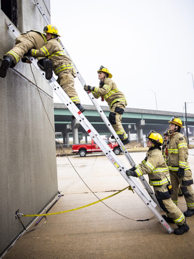 Firefighters Wichmann, Michael McFarlane, Shelby Van Weelden, Zack Howell, and Jake Bawek test their ladder skills at a training tower in Cedar Rapids on Monday, Jan. 2, 2023. In her time in the fire service, Wichmann said she’s been treated very well on the management and crew level and has the support one needs in the CRFD. “Were here 24 hours a day, we experience the same calls,” Wichmann said. “Working with these people day in and day out, you forge a very special bond with them”