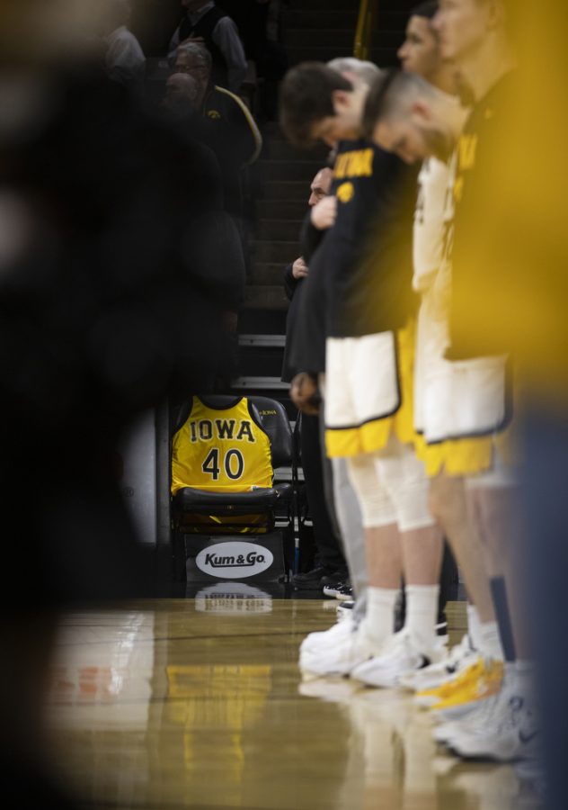 The jersey of former Iowa player Chris Street is seen while players stand for the national anthem before a men’s basketball game between Iowa and Northwestern at Carver-Hawkeye Arena in Iowa City on Tuesday, Jan. 31, 2023. The jersey was placed to honor the memory of Street. The Hawkeyes defeated the Wildcats, 86-70. 
