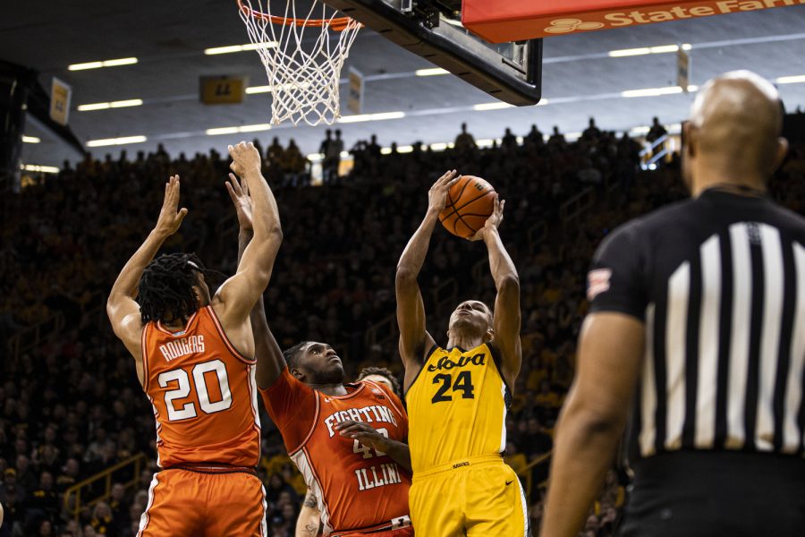Iowa forward Kris Murray attempts a shot during a men’s basketball game between Iowa and Illinois at Carver-Hawkeye Arena in Iowa City on Saturday, Feb. 4, 2023. Murray was fouled on the play. The Hawkeyes defeated the Illini, 81-79.