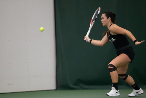 Iowa’s Anya Lamoreaux prepares to hit the ball during a women’s tennis meet at the Hawkeye Tennis & Recreational Complex on Sunday, Feb. 5, 2023. The Hawkeyes defeated the Wildcats, 4-1.