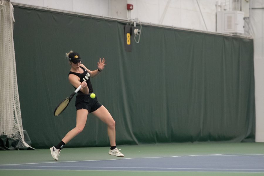Iowa’s Samantha Mannix prepares to hit the ball during a women’s tennis meet at the Hawkeye Tennis & Recreational Comple on Sunday, Feb. 5, 2023. The Hawkeyes defeated the Wildcats, 4,1.