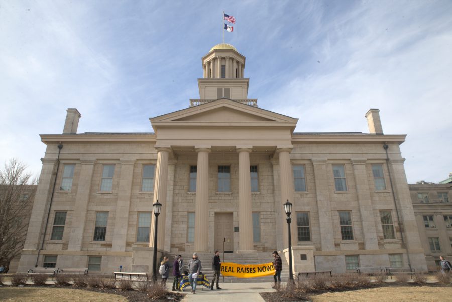 COGS protesters are seen in front of the Old Capitol in Iowa City on Monday, Feb. 6, 2023. 