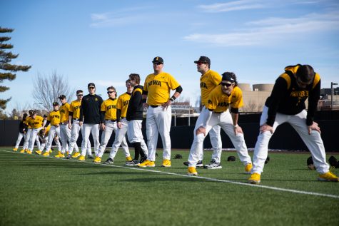 Iowa players prepare for sprints during the Iowa mens baseball media day at Duane Banks Baseball Stadium in Iowa City on February 8, 2023. With many new players on the field, head coach Rick Heller has his sights on Omaha.