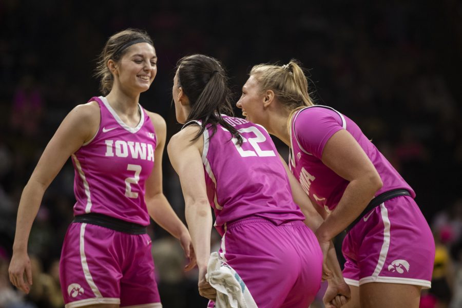 Iowa guard Taylor McCabe (2) celebrates with teammates during a basketball game between No.5 Iowa and Rutgers at Carver Hawkeye Arena in Iowa City on Sunday, Feb. 12, 2023. The Hawkeyes defeated the Scarlet Knights, 111-57. McCabe scored 12 points and made four three-point shots.
