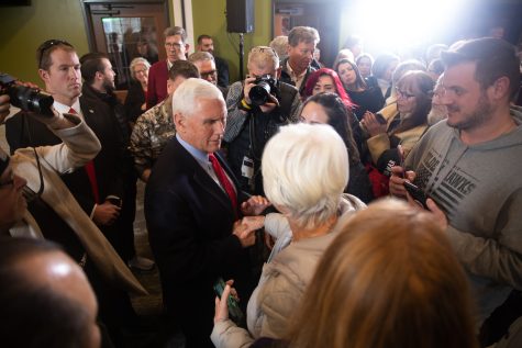 Former Vice President Mike Pence shakes hands with an attendee at Pizza Ranch in Cedar Rapids, Iowa on February 15, 2023.