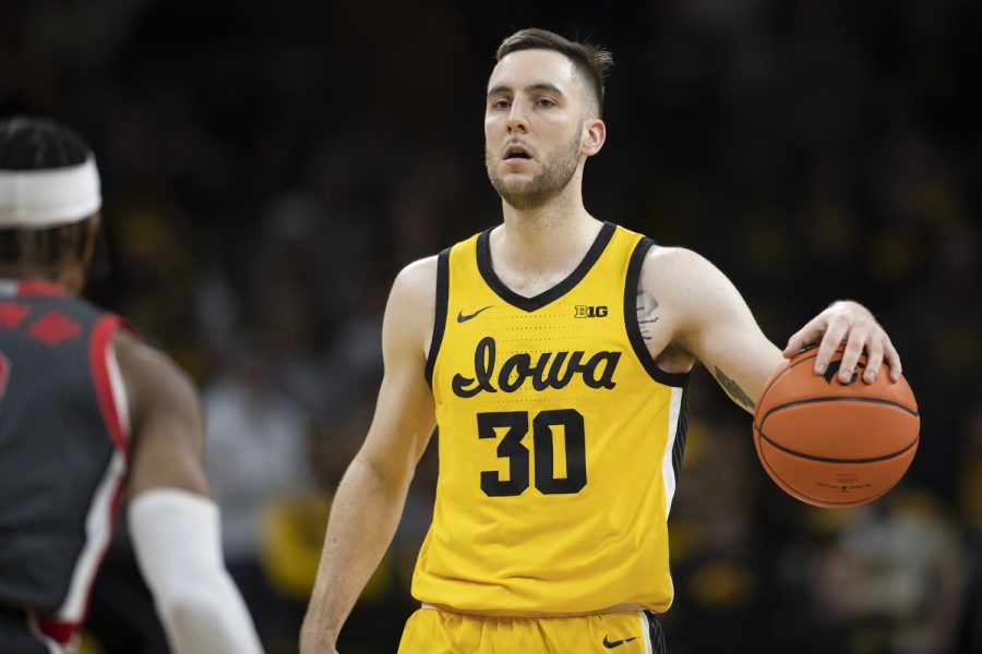 Iowa guard Connor McCaffery takes the ball down court during a men’s basketball game between Iowa and Ohio State at Carver-Hawkeye Arena in Iowa City on Thursday, Feb. 16, 2023. The Hawkeyes defeated the Buckeyes, 92-75.